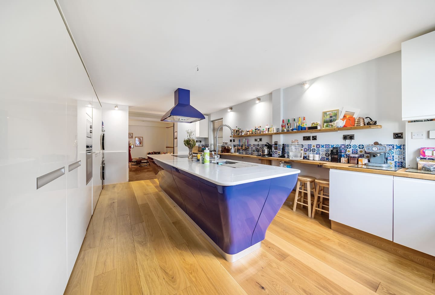 Open plan kitchen with bespoke purple island and solid oak parquet flooring — Belmont Deco Noir Ground Floor Suite Bristol