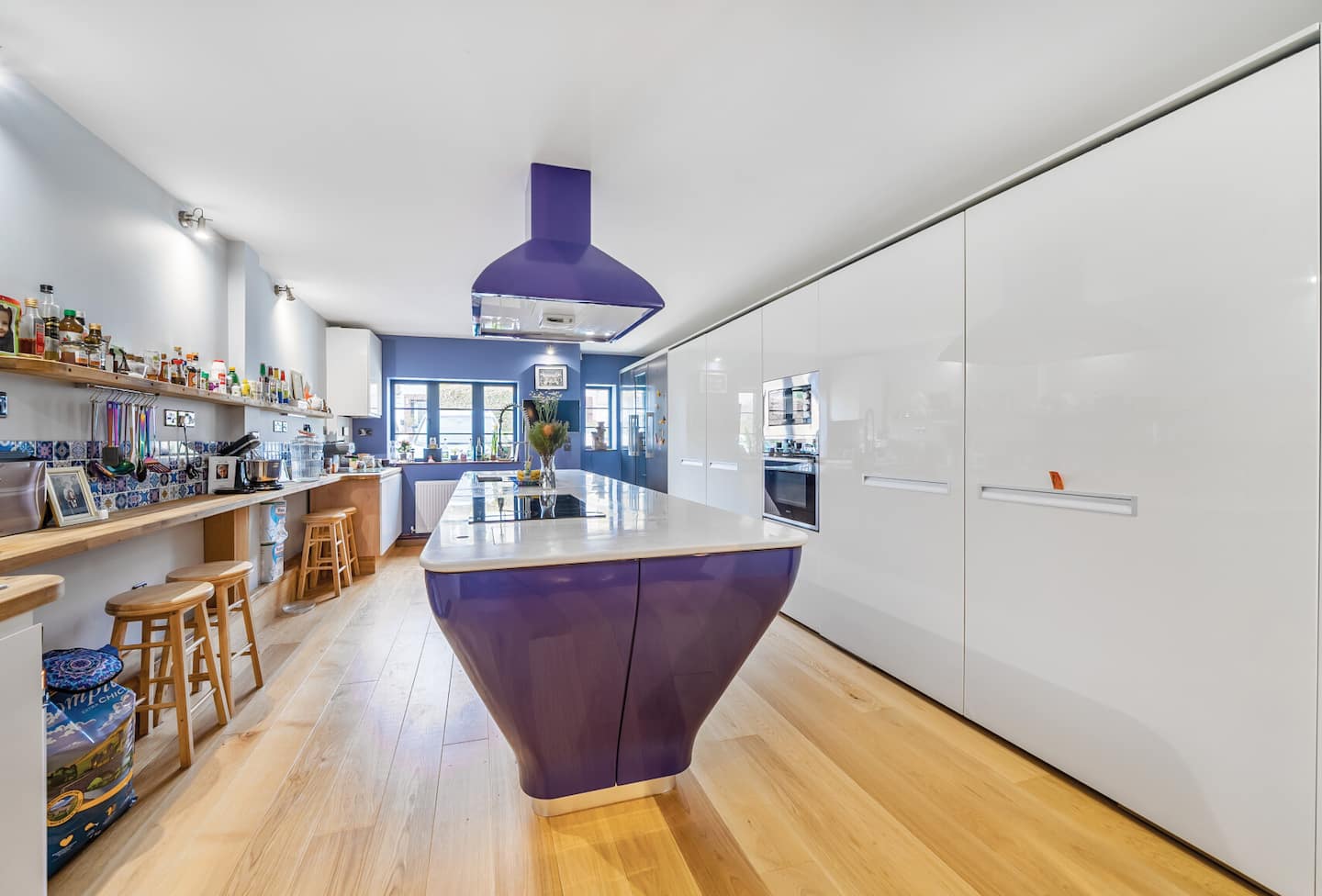 Belmont Deco Noir Ground Floor Suite — bespoke purple kitchen island with bar seating