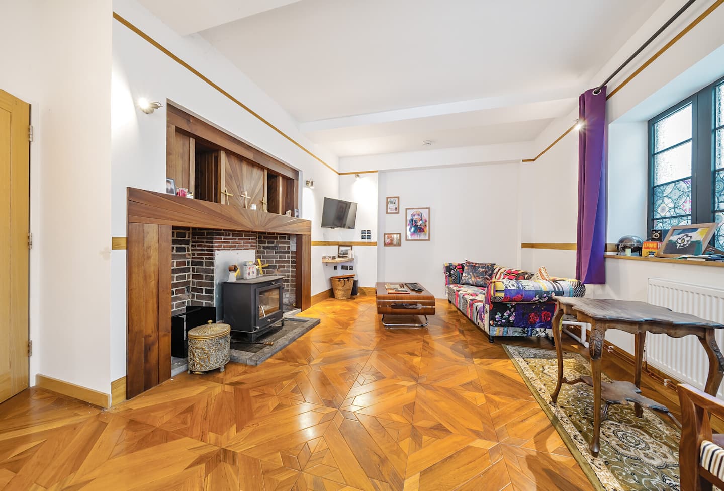 Open plan living and dining room with original parquet flooring and feature fireplace — Belmont Deco Noir Ground Floor Suite Bristol