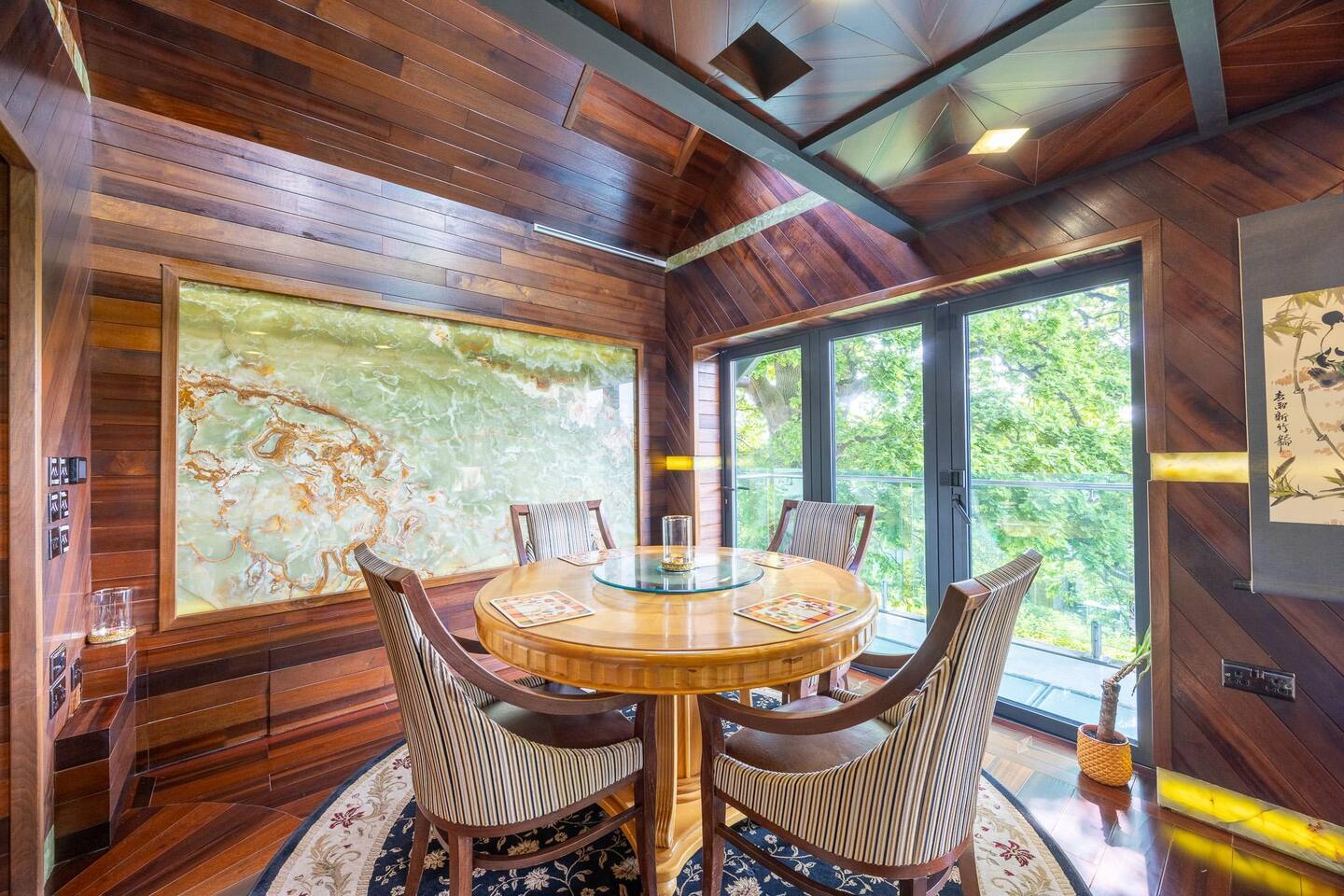 Green Onyx gemstone dining room with panoramic oak canopy views — penthouse Bristol