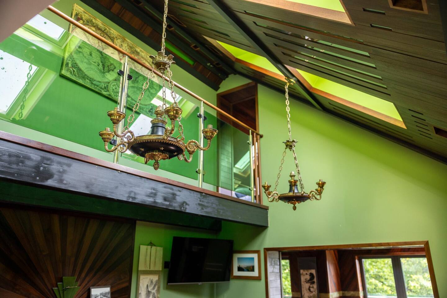 Belmont Deco Noir Penthouse — double-height vaulted drawing room with French chandeliers